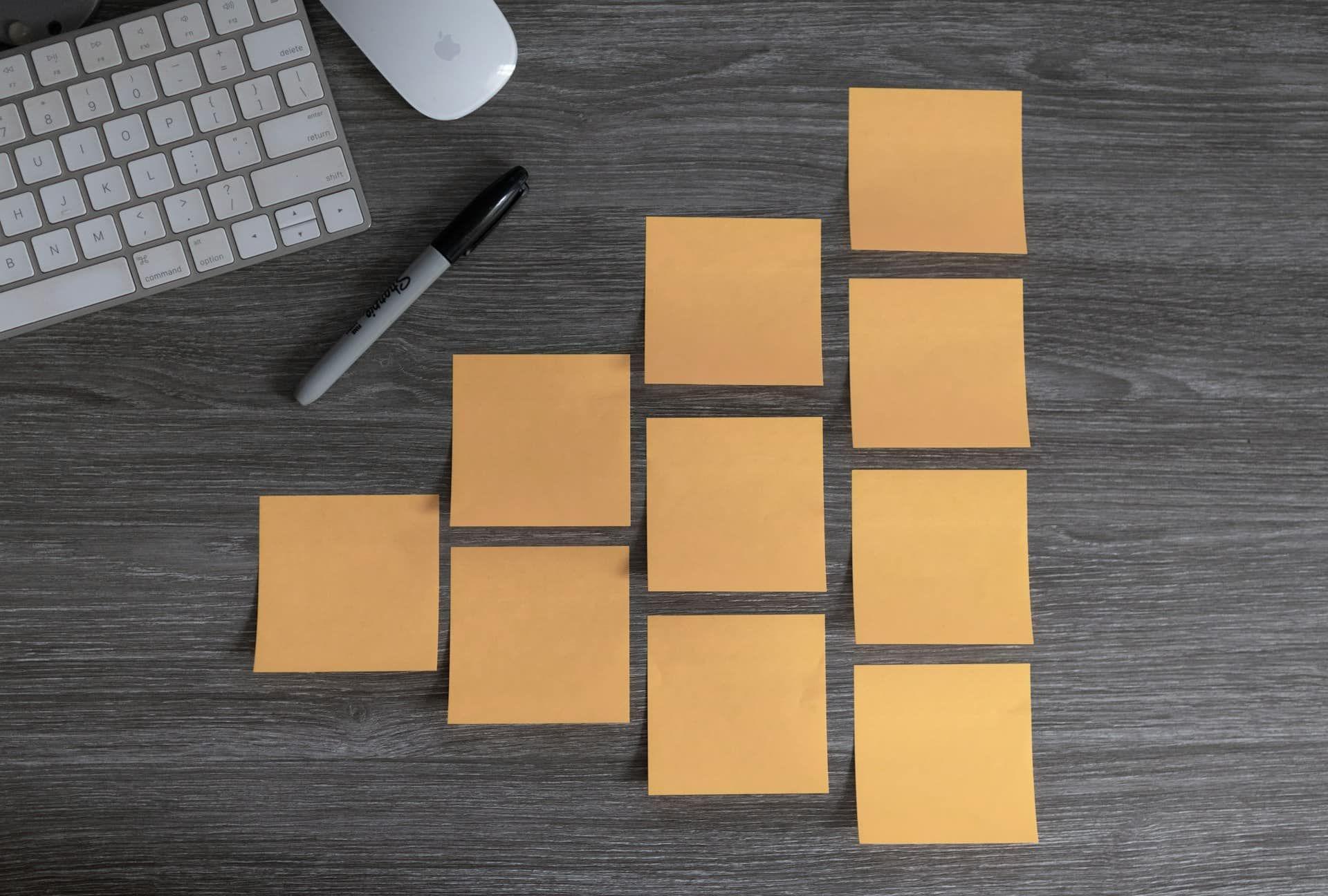 a group of yellow post-it notes on a desk