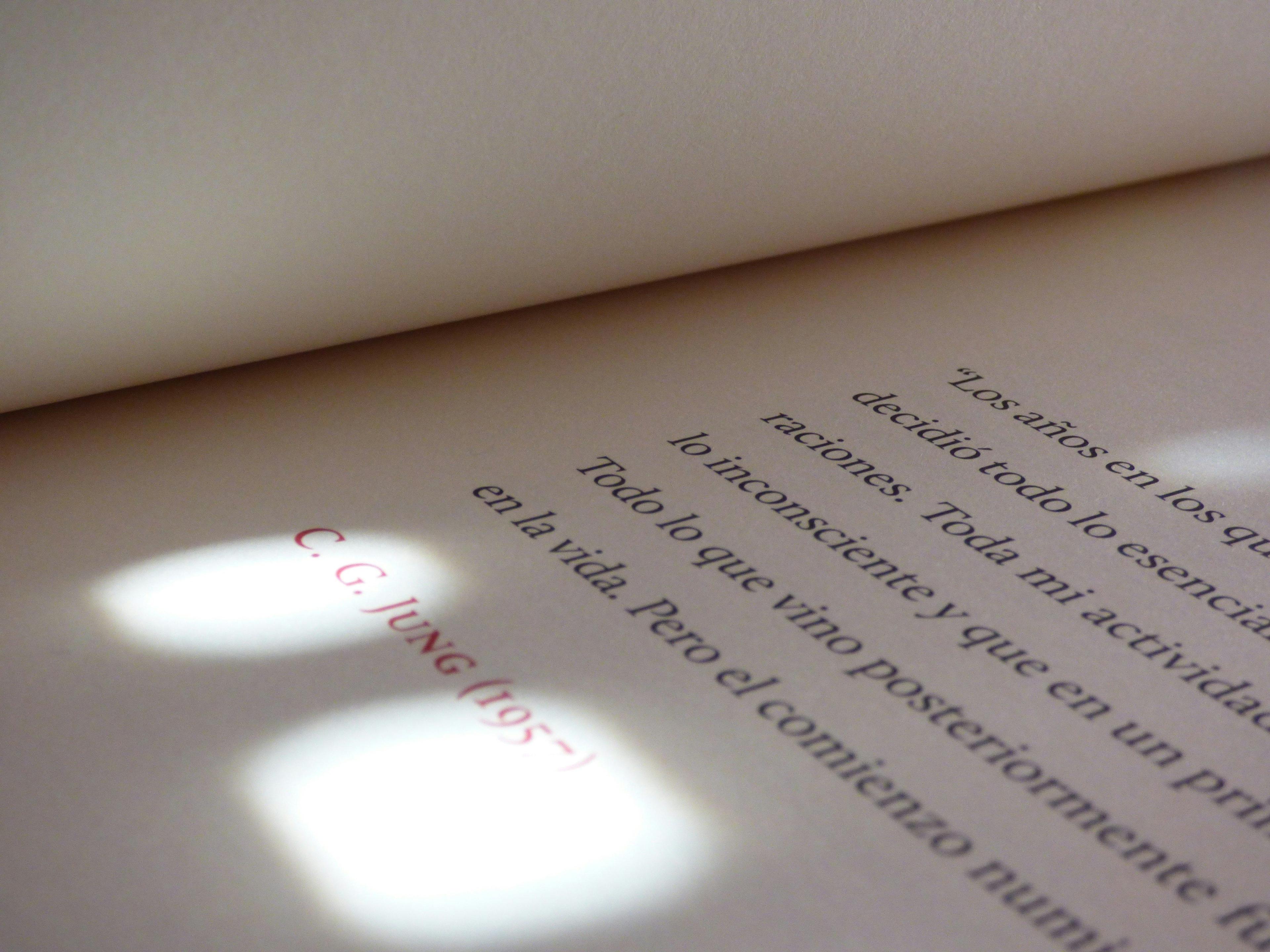 a close up of a book with a light shining on it