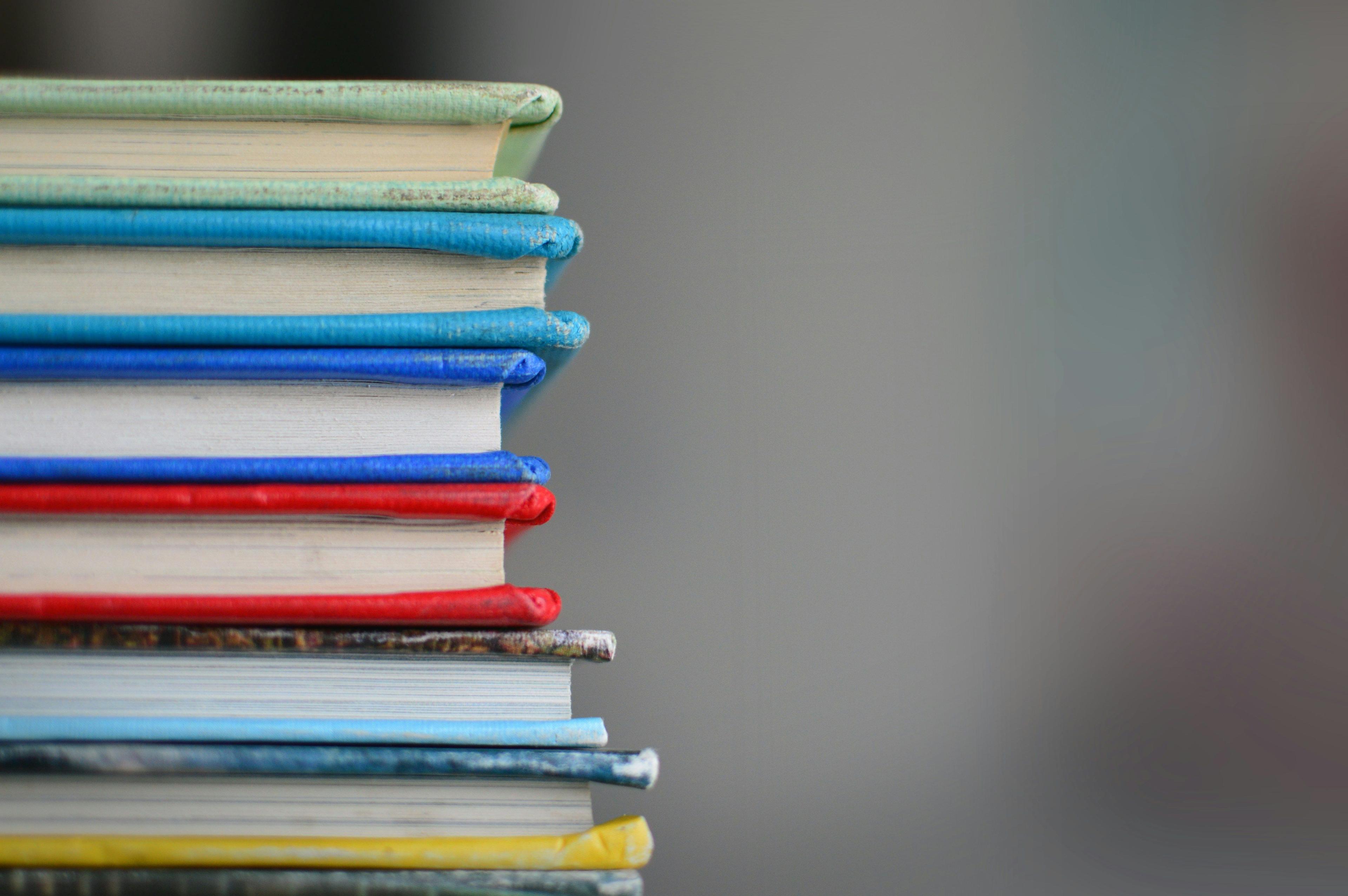 a stack of books sitting on top of each other