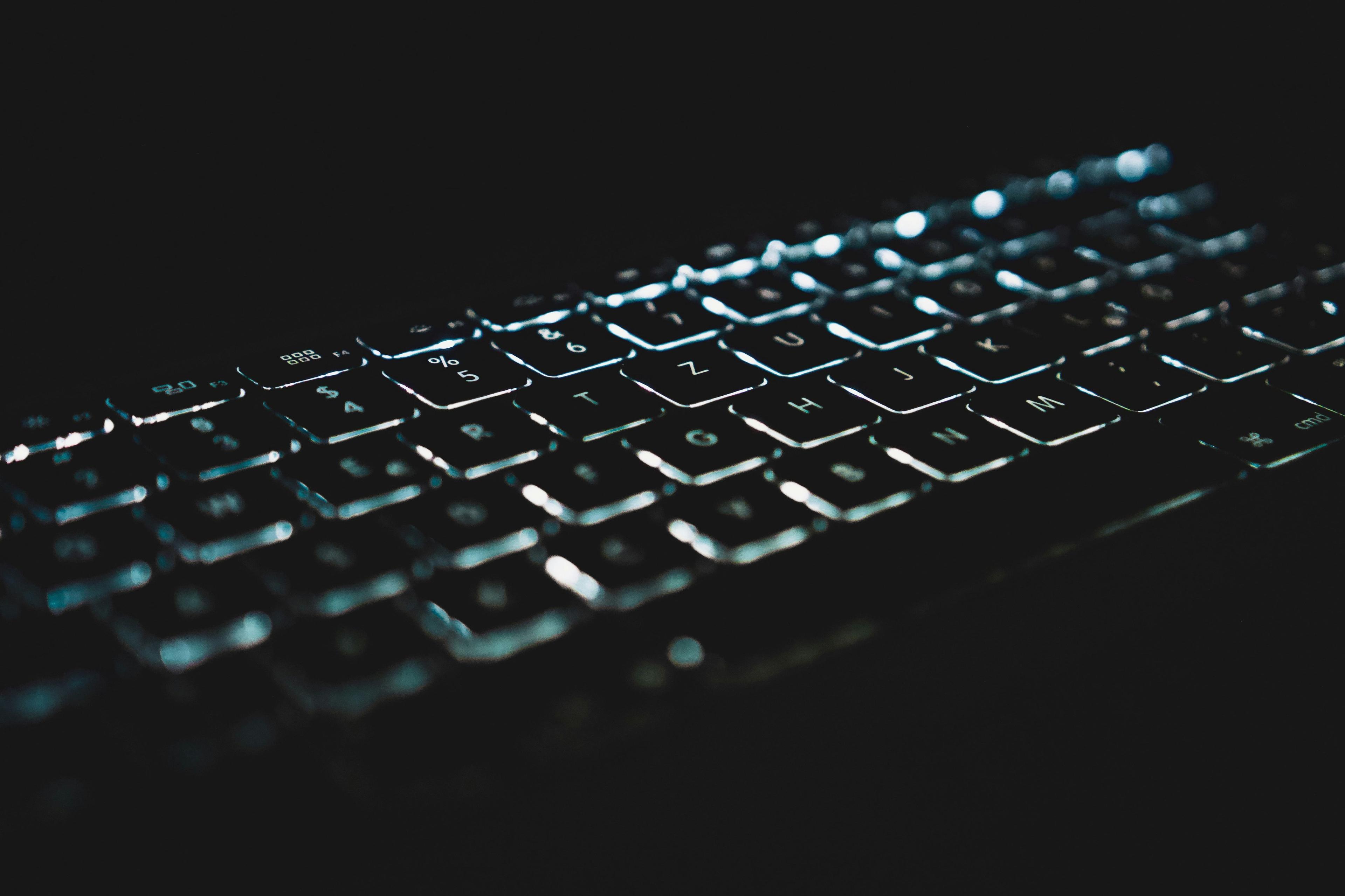 A close-up of a keyboard in the dark