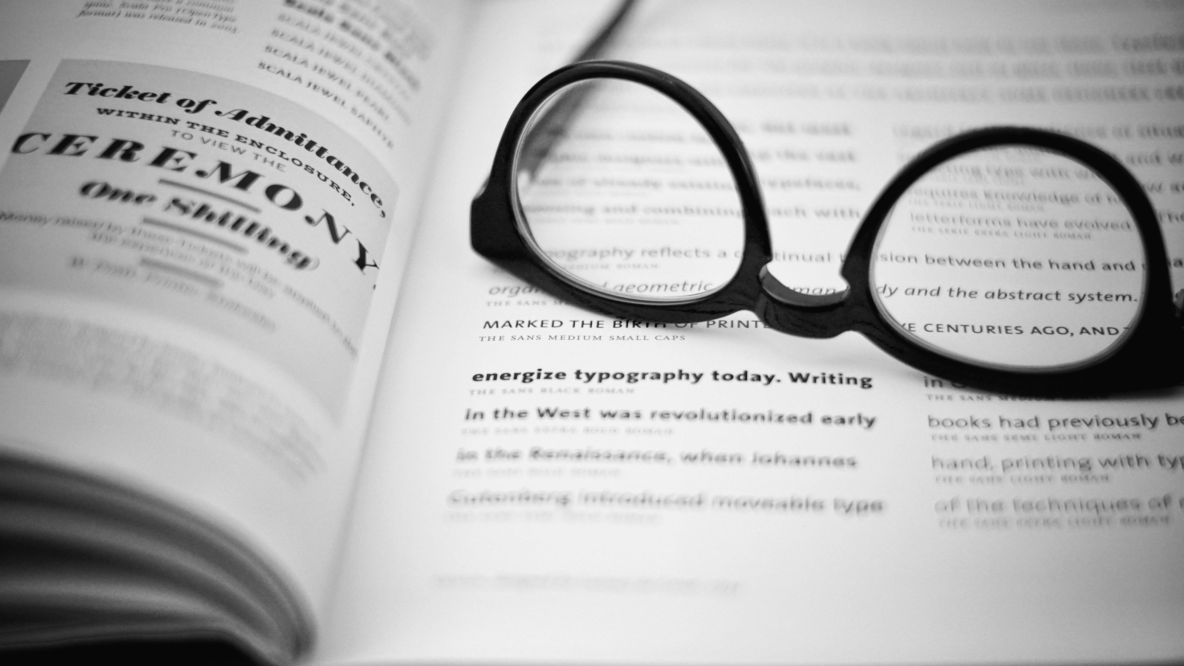 a book with a pair of glasses on top of it